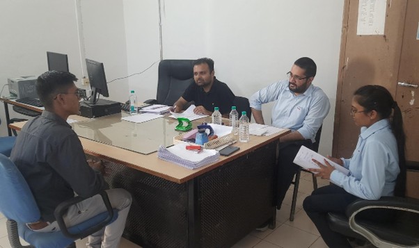 Students in discussion with Training and Placement Cell staff in an office